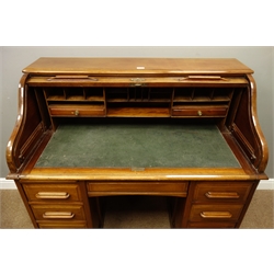  Early 20th walnut roll top desk, serpentine tambour and fitted interior above eight drawers, lock stamped Angus London, W121cm, H115cm, D65cm  