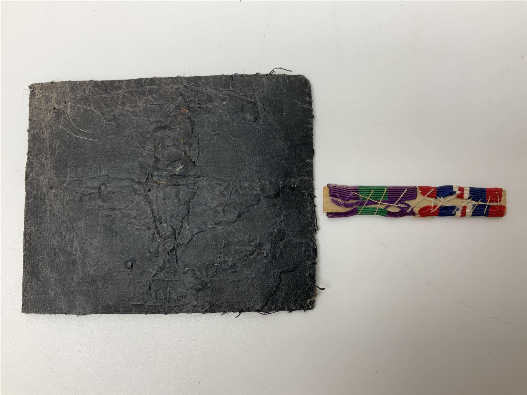 Parachute regiment - chrome crest on oak easel shield; three cloth badges; small silver plated figure; and pin badge; together with 10cm diameter cannon ball etc