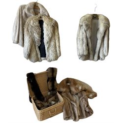 Five short ladies fur coats, together with four fur stoles and a wicker suitcase.  
