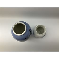 Two Royal Copenhagen vases, first example a vase of baluster form with apple blossom design on a pale blue ground, model no 2629 design no 2129 H27.5cm, second example a vase of ovoid form, with flower and butterfly decoration, model no 2667 design no 36 H17.5cm. 