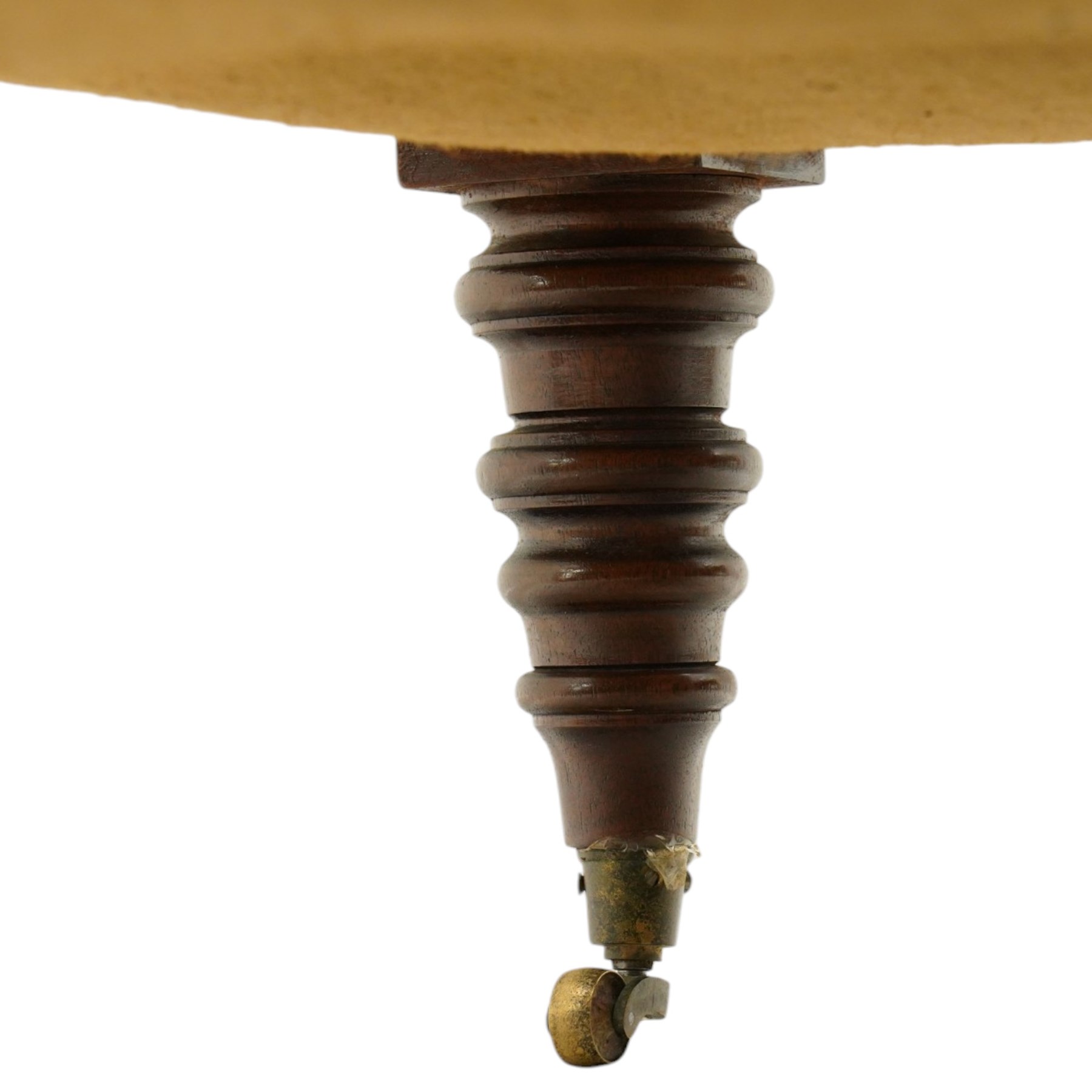 Georgian design footstool of generous proportions, the large rectangular seat upholstered in olive green buttoned leather, raised on heavily turned supports with brass castors