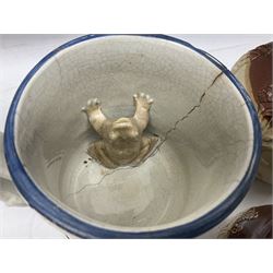 Three Prattware pot lids mounted in wood frames, Staffordshire frog mug, Doulton Lambeth jug etc, largest H18cm