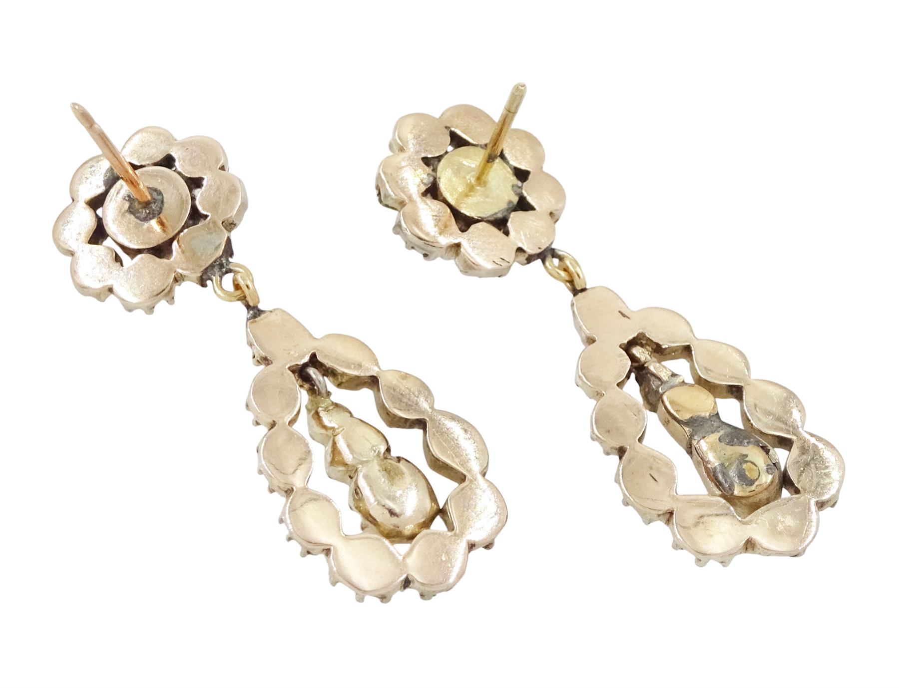 Pair of 19th century gold and silver rose cut diamond pendant earrings, each stud with a pear shaped diamond pendant and drops, suspending from a cluster of diamonds