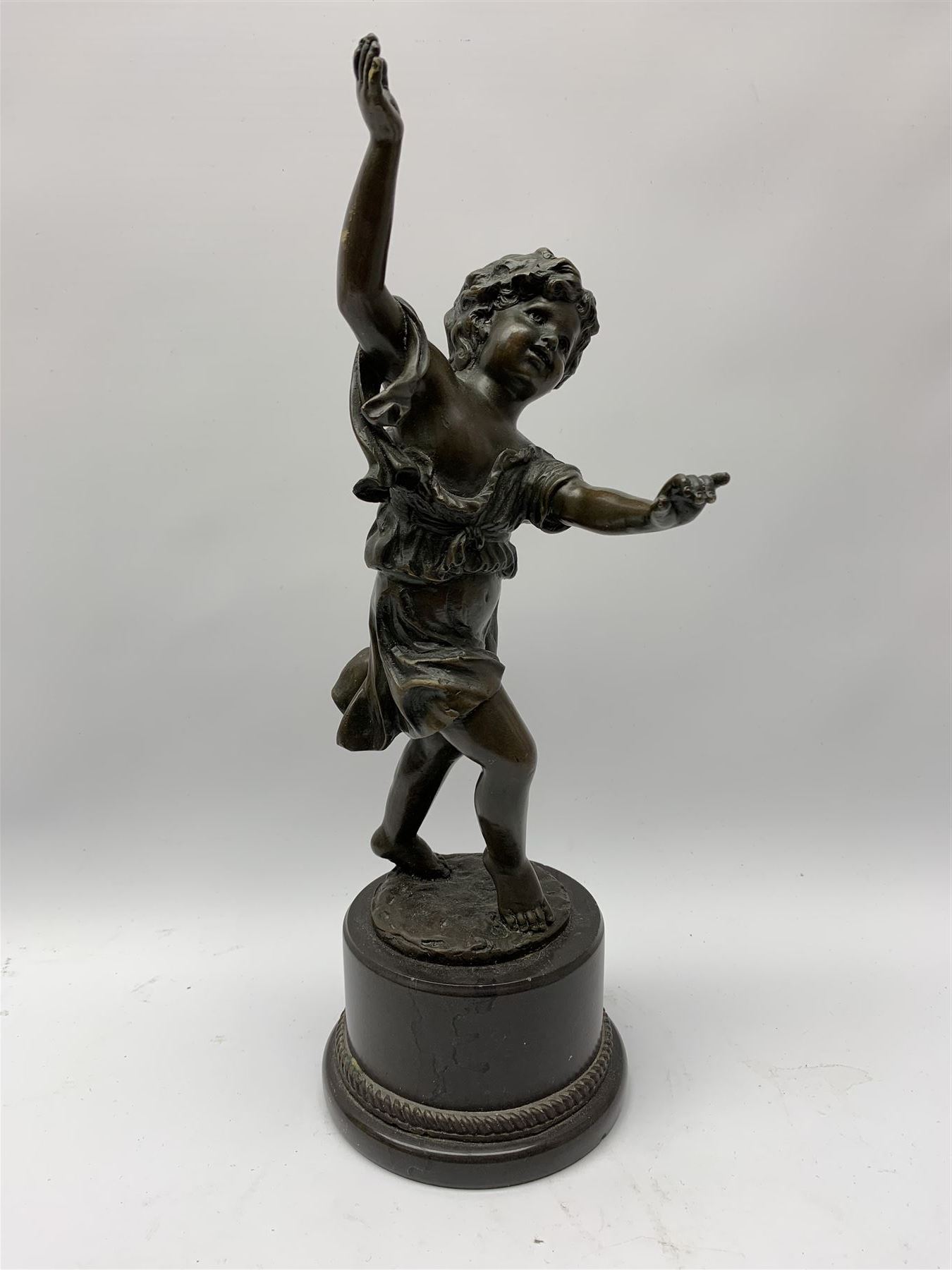 After E Plat, bronze modelled as a dancing child, signed E. Plat, upon cylindrical black marble base, H40cm