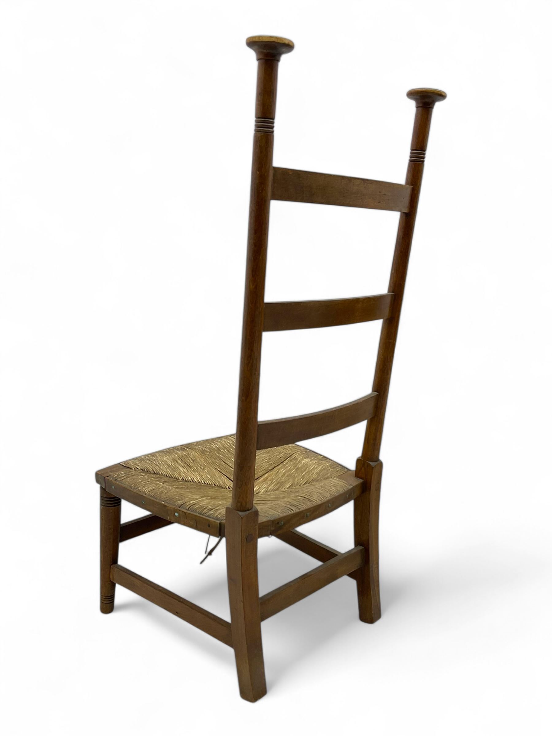 Attributed to William Birch of High Wycombe - Arts & Crafts oak ladder-back side chair, with turned finials, rush seat, and stretchers, raised on square-section supports; 19th century mahogany Pembroke table, rectangular drop-leaf top raised on turned supports with central stretcher and splayed feet