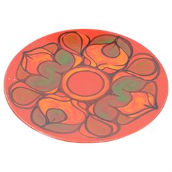 Three Poole pottery chargers, in Wild Poppy pattern, Delphis pattern and Aegean pattern, together with a Poole pottery dish and plate  