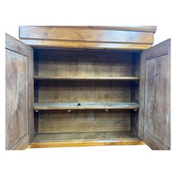 19th century French walnut dresser, the moulded cornice over two-panelled cupboard doors, enclosing two shelves and one small
drawer, on a base of two further cupboards