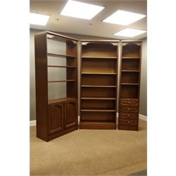  Medium oak bookcase with cupboard (W82cm, H195cm, D38cm), and two other similar bookcases  