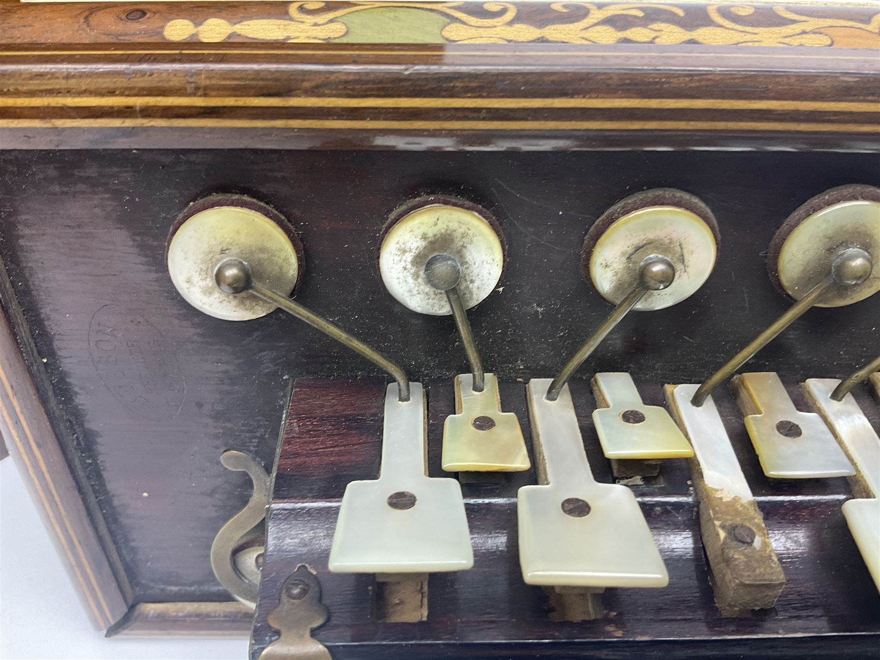 19th Century inlaid rosewood Flutina accordion, stamped Busson of Paris, having sixteen mother of pearl keys and six fold floral decorated bellows L30cm; in baize lined mahogany box
