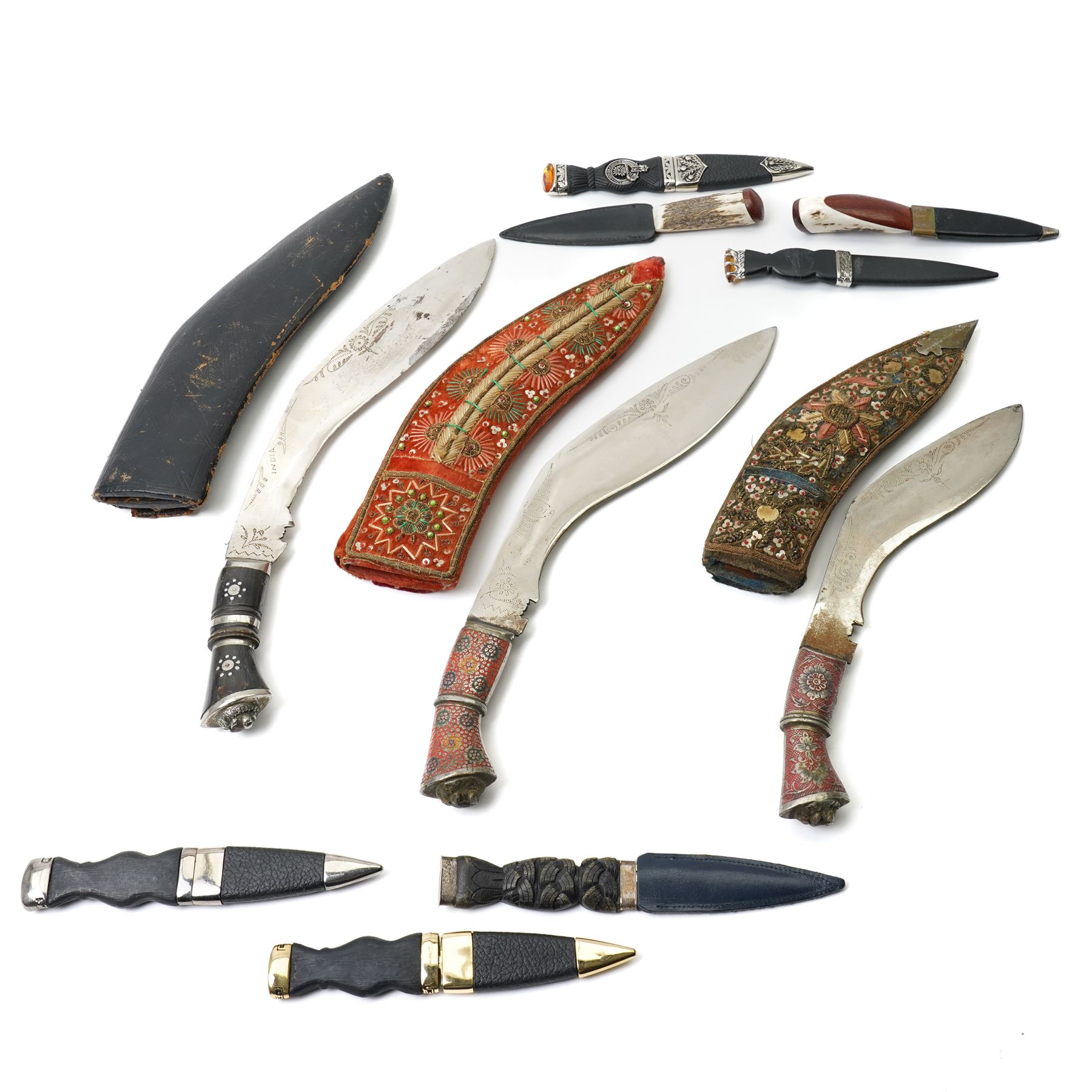 Three modern Indian kukris and seven Scottish skean dhu