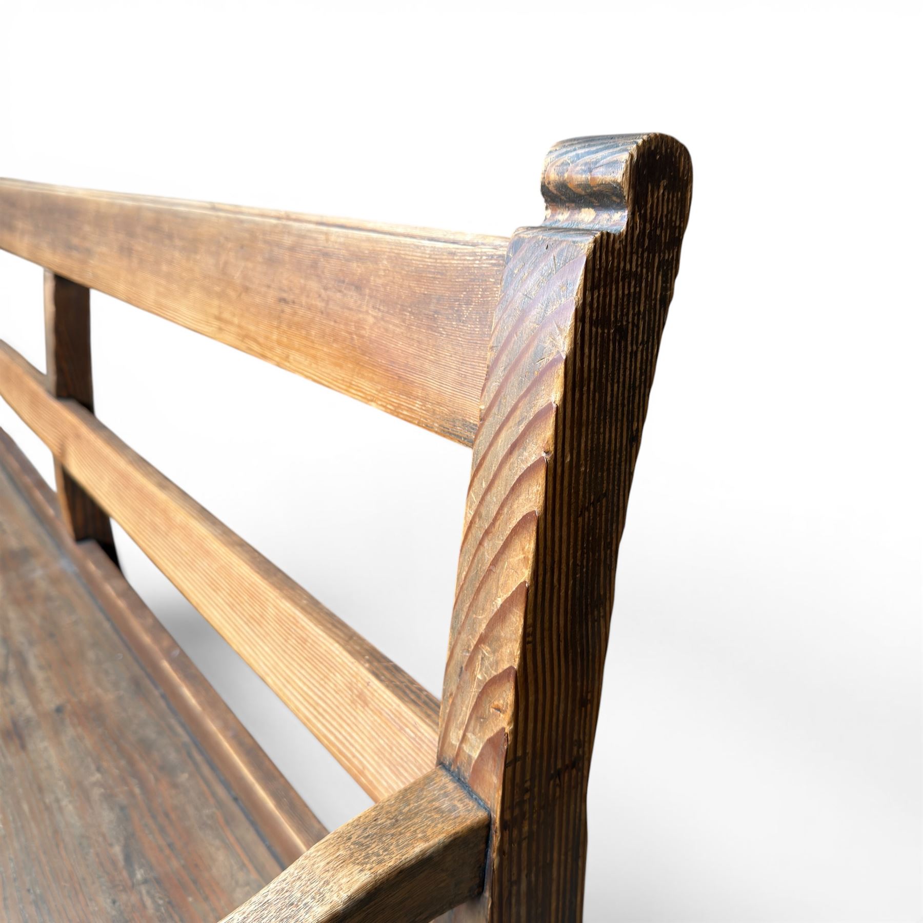 Early 20th century pine and oak bench seat, stained pine rail back frame with shaped oak arms
