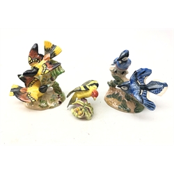  Two Beswick Bird Groups comprising American Blue Jays no. 925 Baltimore Oriole no. 926 and a Royal Worcester Western Tanager (3)  