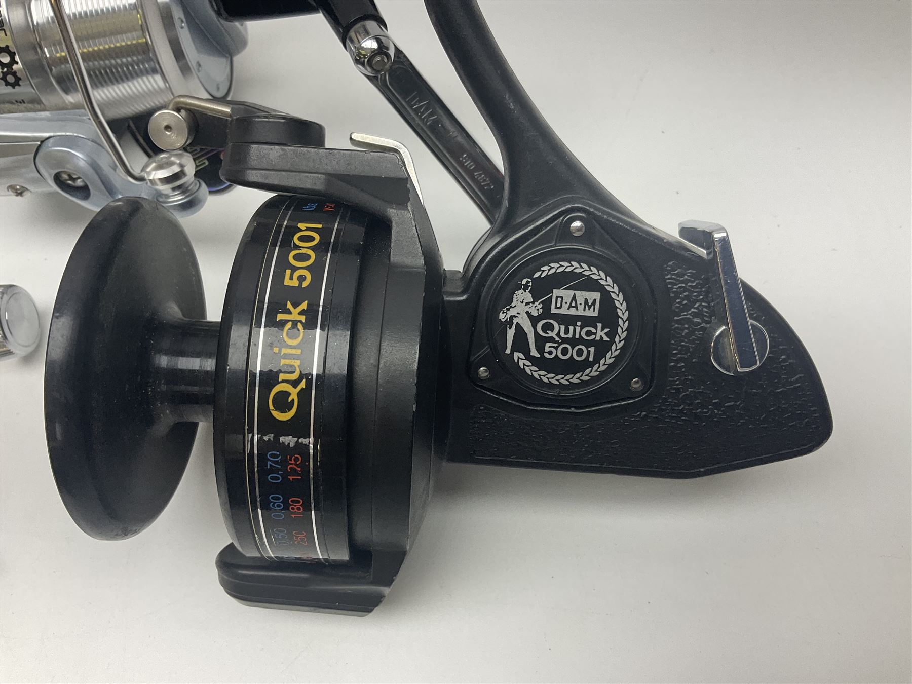 Four fixed spool reels, all in original boxes, comprising Shimano Ultegra 5500 XSD, with spare spool, Mitchell Autosurf 700, with spare spool, Shimano Sedona 600 FB with spare spool and D.A.M Quick 5001