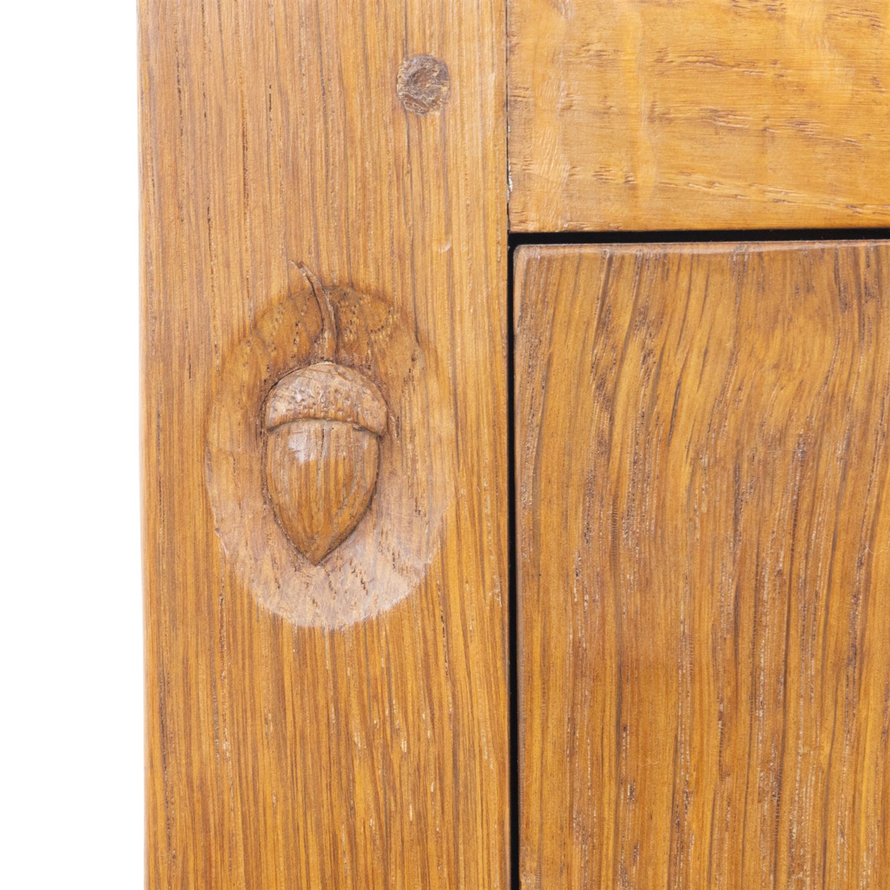 Acornman - oak adzed panelled double wardrobe, with wrought iron hinges and carved oak latch revealing a single clothes rail, with signature carved acorn to top left, by the workshop of Alan Grainger, Brandsby