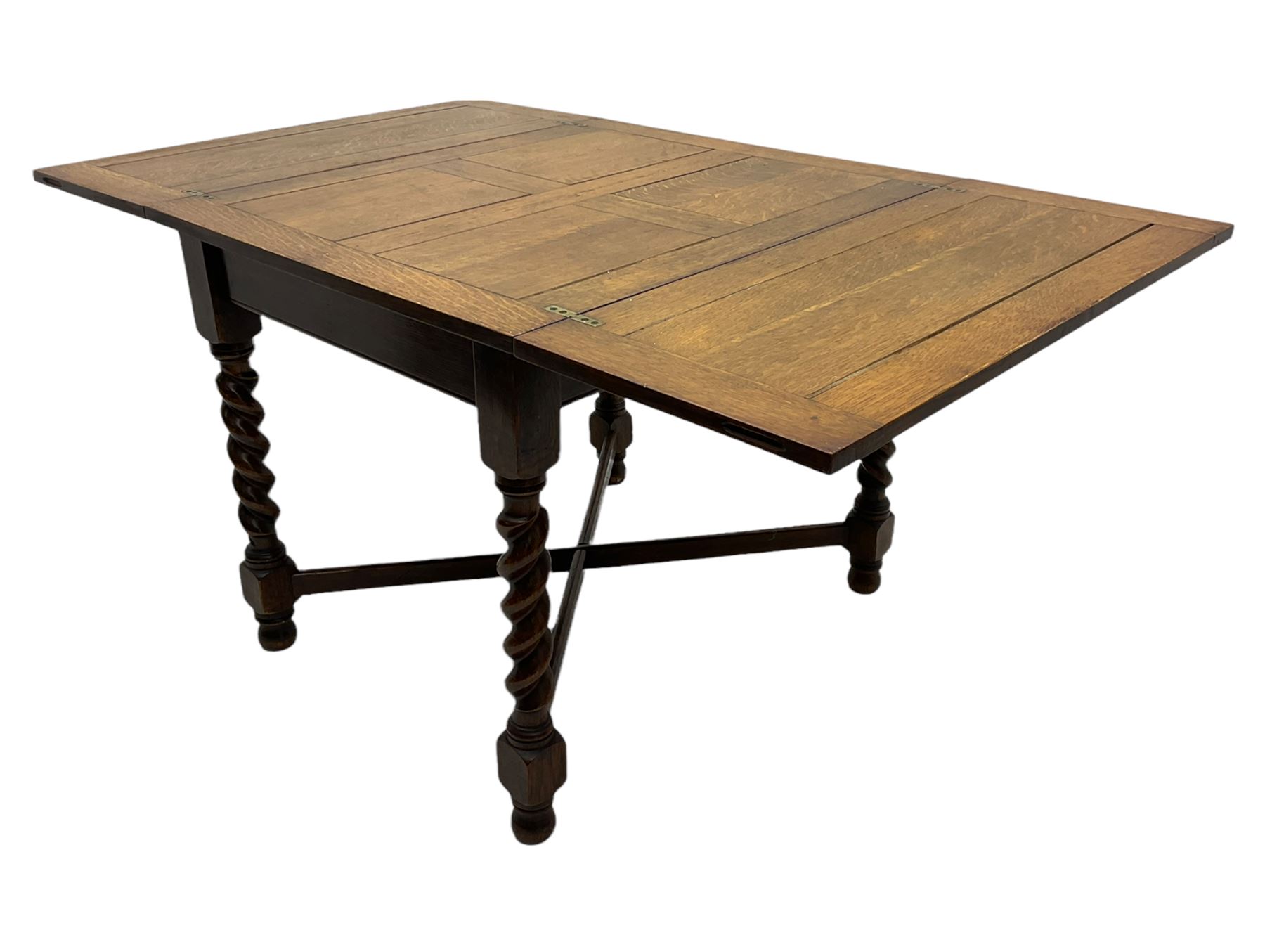Early 20th century oak barley twist extending table, two fold-over leaves with pull-out stays, spiral turned supports joined by x-stretchers