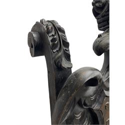 Grand mid-to-late 19th century heavily carved beech framed throne chair, the crown pediment carved with flower heads and cross finial, scroll and acanthus carved upright supports with twin perching griffin back enclosing etched leather work heraldic shield with castle and lion motifs over splayed feathers, flower head carved down sweeping arms with grotesque carved terminals, the seat rails carved with further flower heads on moulded supports with oversized ball and claw carved feet

Provenance: A very similar chair was used in the filming of Stanley Kubrick's 'Eyes Wide Shut' (1999)
