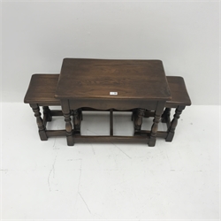 Early 20th century oak nest tables, baluster turned supports joined by square supports, W62cm, H46cm, D37cm