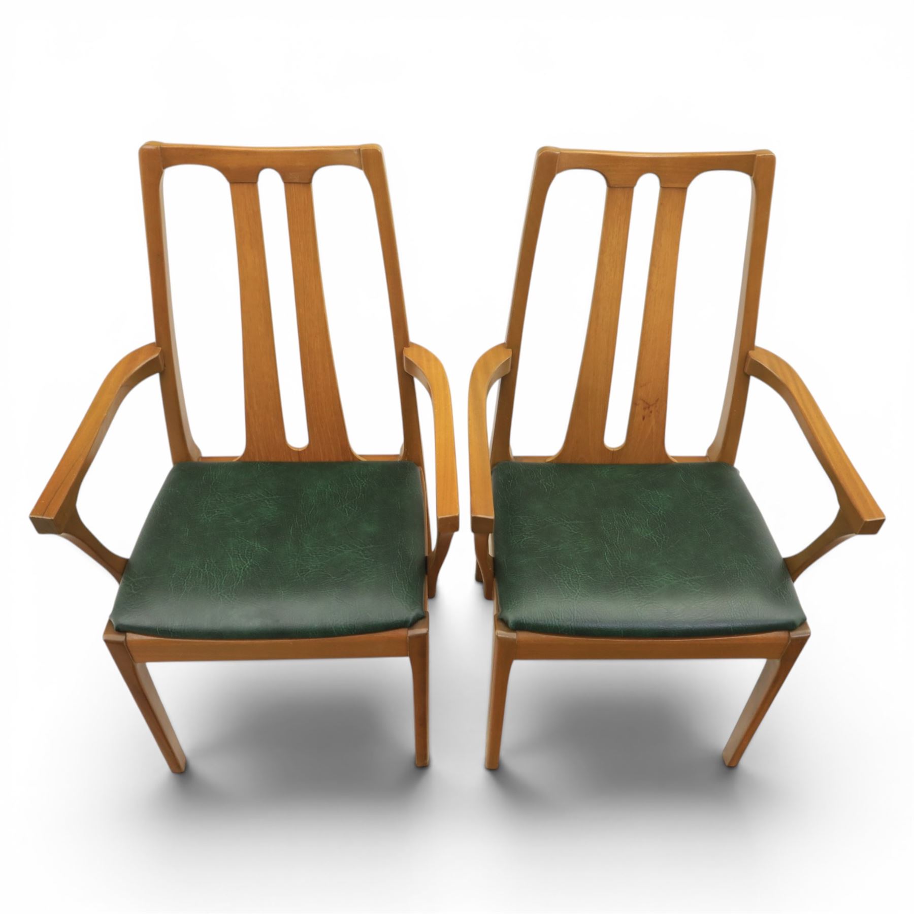 A pair of Nathan 'Highback Carvers' and a 20th century nest of teak tables, (Tables W65cm, D38cm, H49cm)
(Carvers W57, H97)