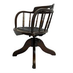 Early 20th century oak framed swivel and tilting Captain's chair, tub shaped back with spindle supports over leather seat