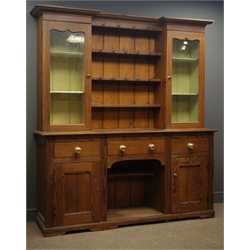 19th century pine dog kennel dresser, raised display cabinets with centre shelving, three drawers and two panelled cupboards below, W175cm, H193cm, D47cm  