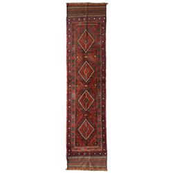 Meshwani Kilim maroon ground runner rug, the field with four central indigo lozenges surrounded by geometric borders