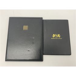 Great Britain Queen Victoria penny black stamp with black MX cancel and 1840 two pence blue stamp with black MX cancel, both housed in folders