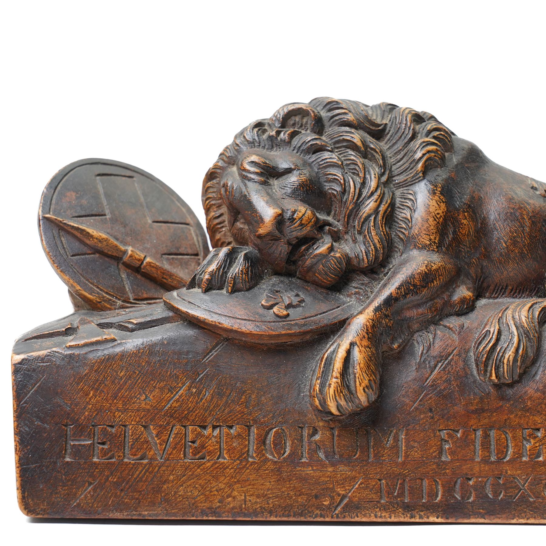 After Bertel Thorvaldsen (Danish 1770-1844): 'The Lion of Lucerne', 19th century walnut carving after the Swiss stone monument, commemorating the Swiss Guards who were killed in 1792 during the French Revolution, H14cm W27cm