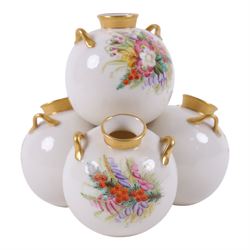 Royal Worcester spill vase, consisting of four conjoined bulbus vases, each hand painted with floral sprigs, with gilt handles and rims, with puce mark beneath, H15cm