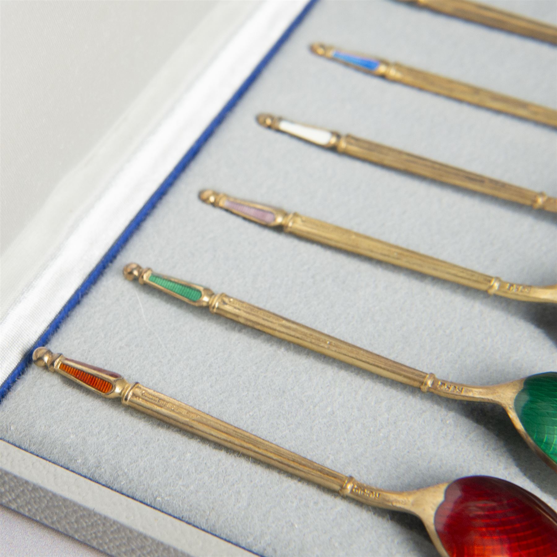 Set of six Danish silver-gilt and guilloche enamel demitasse spoons by Anton Michelsen, stamped A. Michelsen, Sterling, Denmark, with import marks for London, R C P Ltd, in fitted case