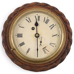 Edwardian 8-day ships bulkhead clock and aneroid barometer, both in circular oak cases with carved rope twist bezels, the clock with a painted metal dial, roman numerals, minute track, steel spade hands and with platform regulation, the barometer with weather predictions, steel indicating hand and brass recording hand with a curved mercury thermometer, largest D28cm