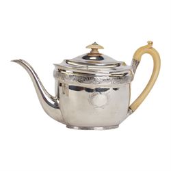 George III silver three piece tea service, comprising teapot with ivory scroll capped curved handle and ivory finial to the hinged cover, twin handled open sucrier with gilt interior, and cream jug with gilt interior, each of oval form with rounded sides, the bodies engraved with central monogram within a seaweed wreath, between engraved foliate bands, hallmarked John Emes, London 1801, teapot including handle H17cm

This item has been registered for sale under Section 10 of the APHA Ivory Act