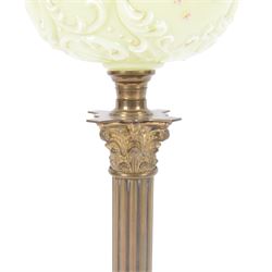 Green glass and brass oil lamps, with frilled glass shade, reservoir decorated with flowers, upon corinthian column with square base, H74cm