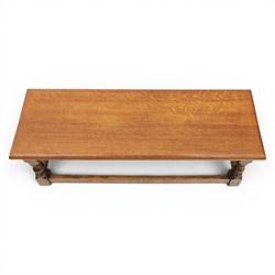 17th century style oak long joint stool, rectangular top with moulded edges, raised on turned supports united by stretchers