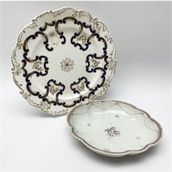 Mid-19th century Chamberlains Worcester plate decorated in blue and gilt incorporating the crest of the 26th Regiment, impressed mark, D26.5cm; together with and early 19th century floral painted shaped oval dish (2)
