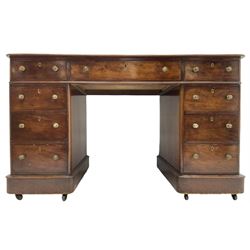 Victorian mahogany twin pedestal desk, rectangular top with inset ebonised leather writing surface, fitted with nine graduating drawers with brass pull handles, on plinth bases