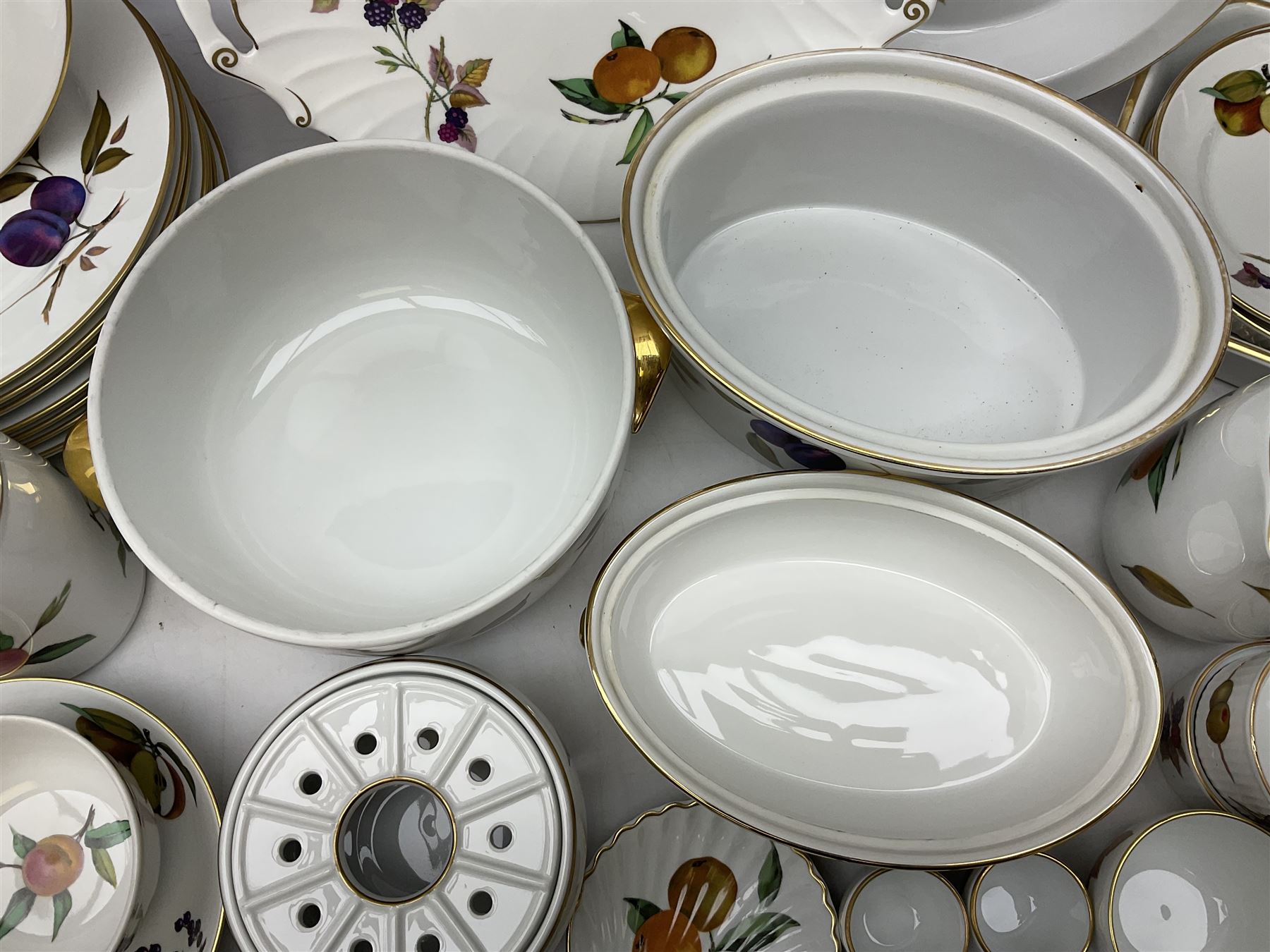 Royal Worcester Evesham pattern dinner wares, to include lidded tureens, eight dinner plates, serving tray, ramekins, jug, seven bowls, egg cups, serving dishes etc, approx 47 pcs, all with printed marks beneath