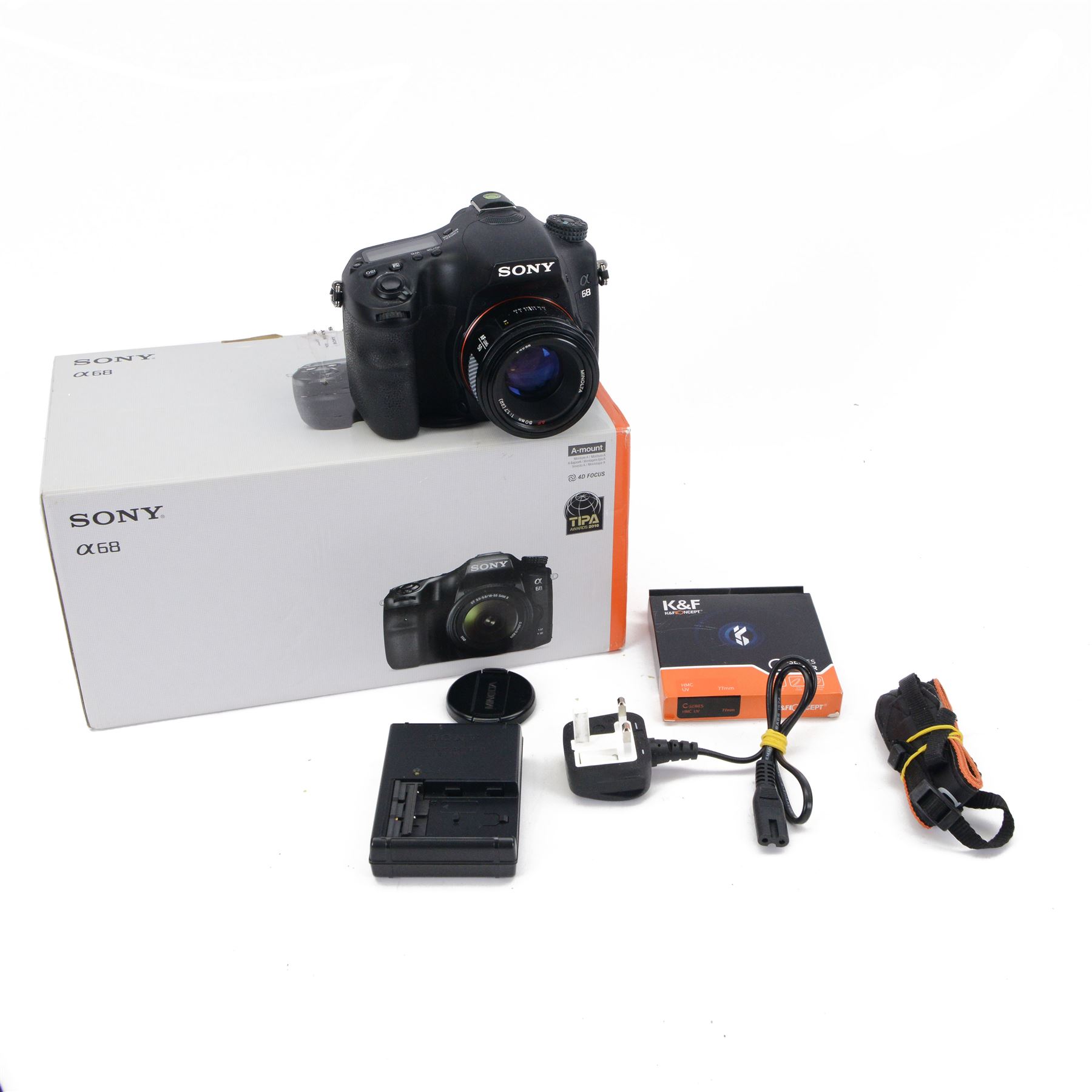 Sony Alpha A68 DSLR camera serial no. 3069011, with a Minolta AF 50mm 1:1.7 lens serial no. 1684887, boxed with charger, instructions and strap