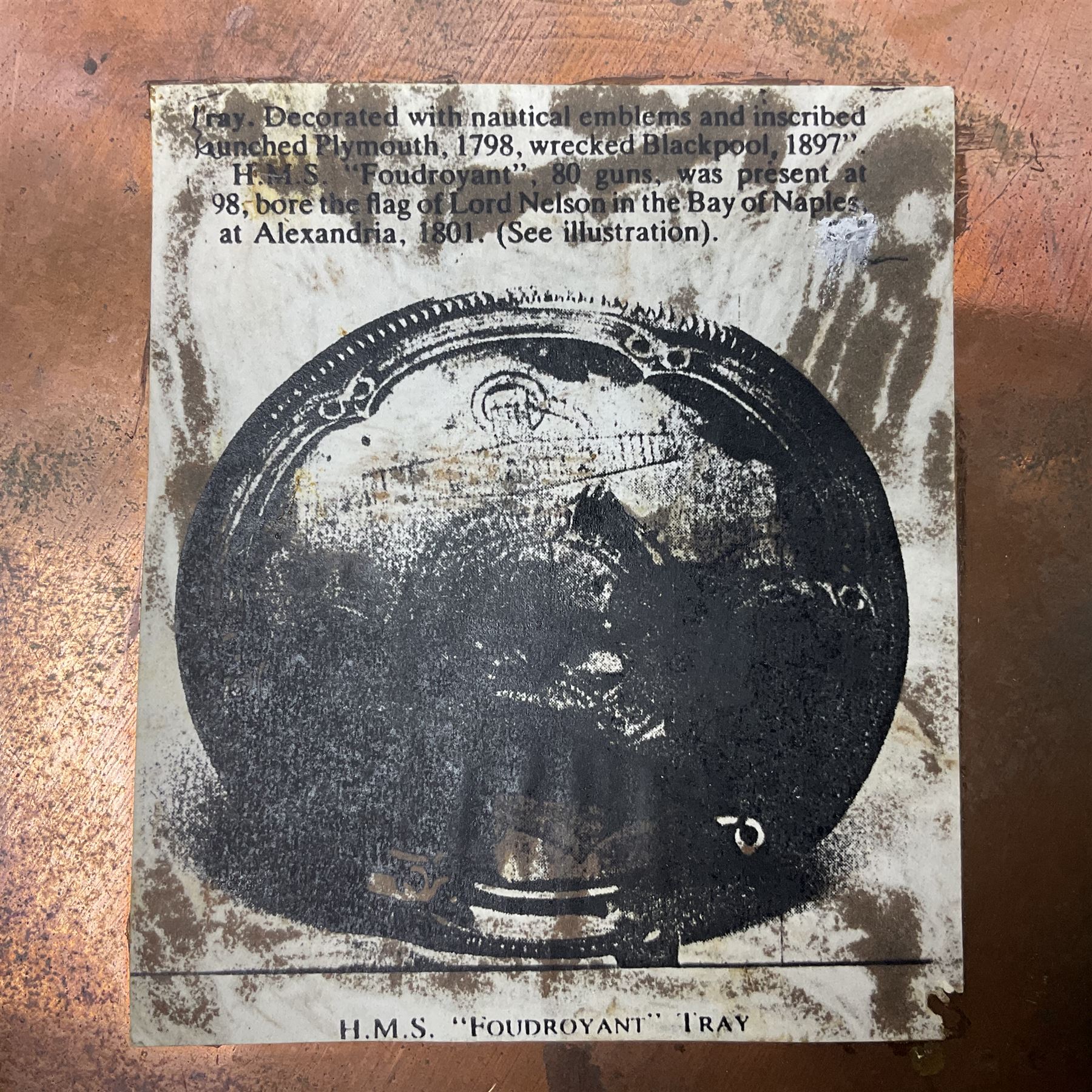 HMS Foudroyant copper tray, with label to reverse, together with a Georgian coin purse, plate D30cm