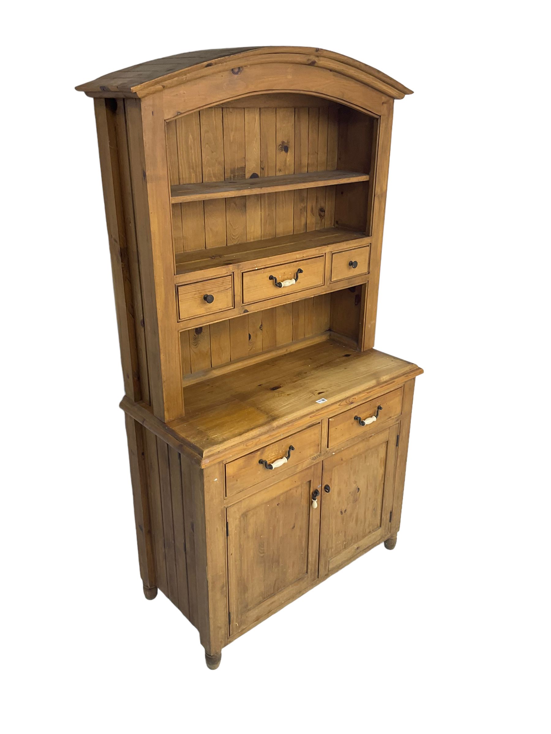 Pine farmhouse style dresser, arched top with projecting cornice over two tier plate rack and