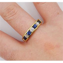 18ct gold channel set seven stone round brilliant cut diamond and round sapphire ring, London assay mark, total diamond weight approx 0.45 carat, total sapphire weight approx 0.70 carat