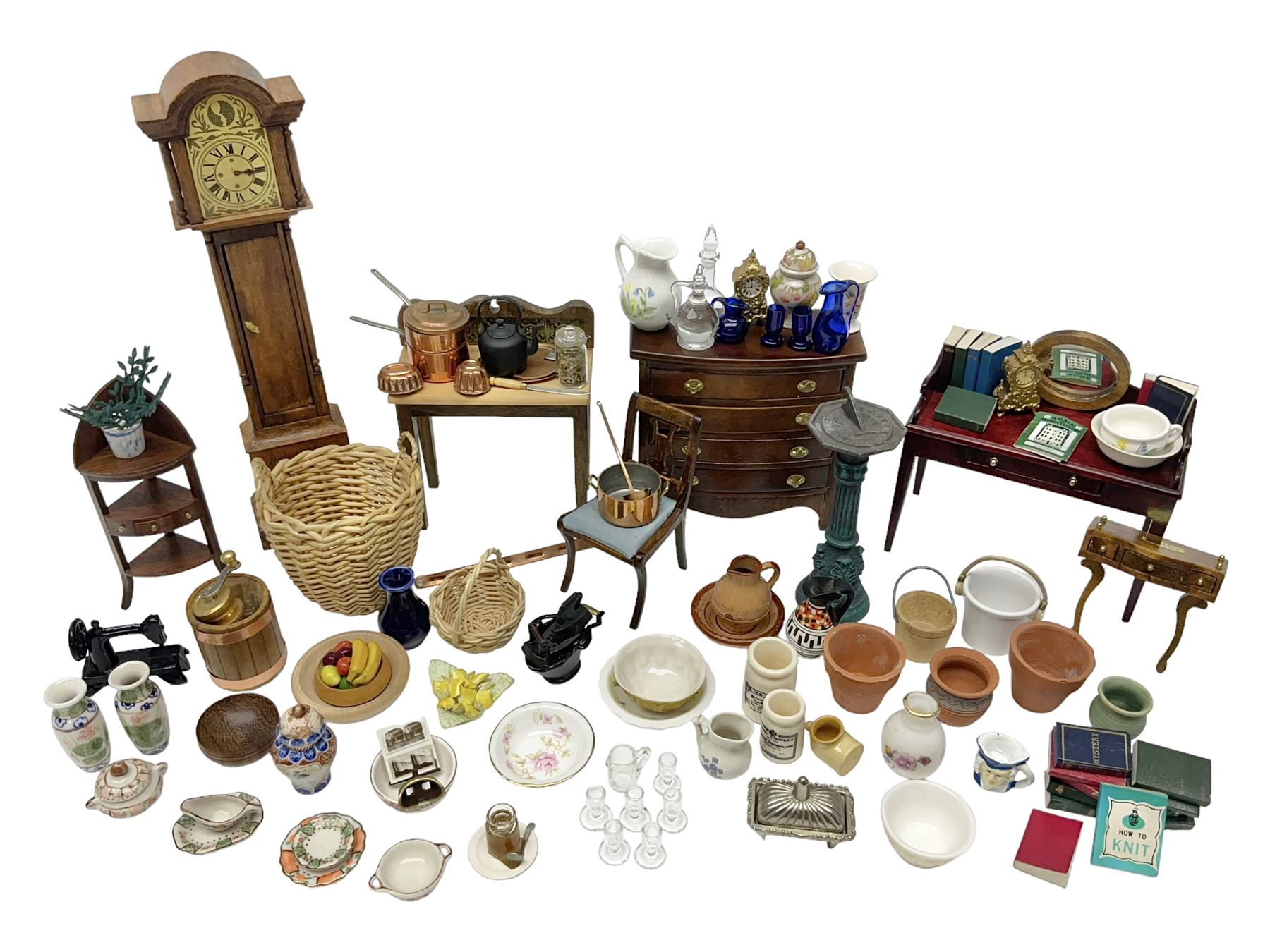 Collection of miniature dolls house furniture and accessories, to include long case clock, chest of drawers, tiled wash stand, ceramics and glass ware, mirror, baskets, etc 