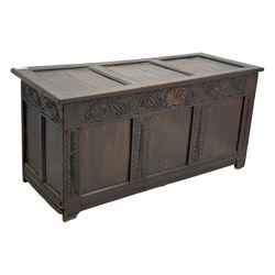 18th-century carved oak blanket chest with hand-carved floral and leaf motifs 