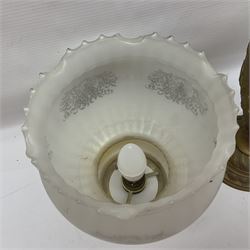 Gilt metal table lamp, heavily embossed with flowers and butterflies, with fluted frosted glass shade, H56cm