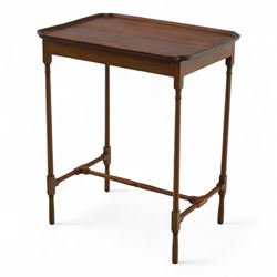 Early 20th century mahogany butler’s tray table, rectangular dished top with shaped corners, raised on turned faux bamboo legs with stretchers