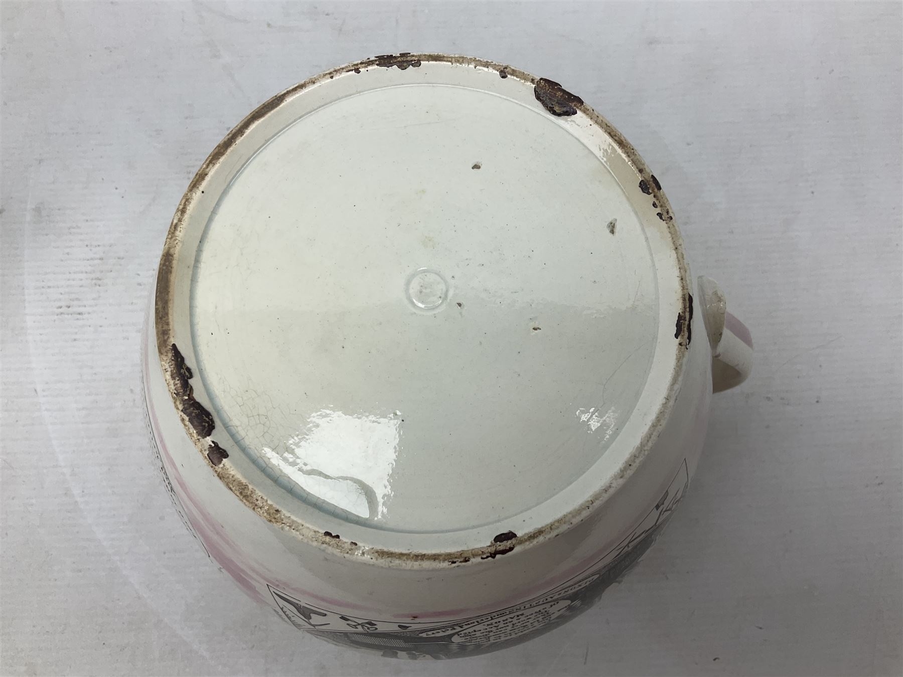 Early 20th century Sunderland lustre jug, decorated with transfer Masonic scene and poem 'The World is in Pain/Our Secrets to Gain/But Still Let Them Wonder and Gaze/The Never Can Divine/The World Nor The Sign/Of a Free and Accepted Mason', the reverse decorated with Sunderland River Wear cast iron bridge scene below text (a/f), together with a copper lustre jug, and pink lustre bowl, jug H20cm