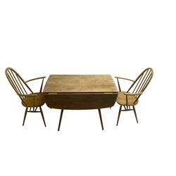 Ercol - elm and beech '383 drop-leaf dining table', rectangular top with rounded corners, raised on splayed tapering supports (110cm x 61cm x 72cm); Ercol - Pair of elm and beech '365a Quaker Back Windsor Armchairs' (63cm x 42cm x 97cm)