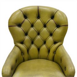 Victorian design tub armchair upholstered in buttoned green leather, on turned front supports