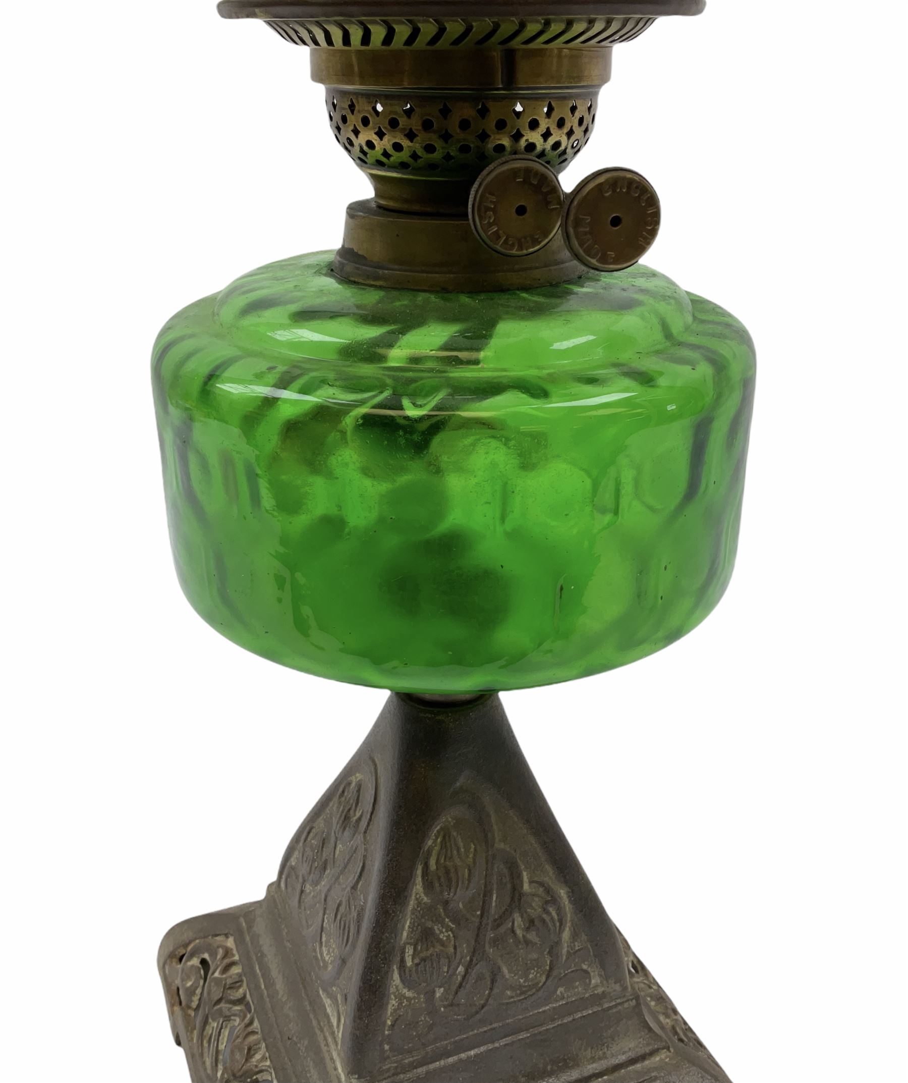 Late Victorian oil lamp, the cast metal base decorated with foliate tendrils, supporting a green glass reservoir, and opaque glass shade and clear class chimney, H60cm. 