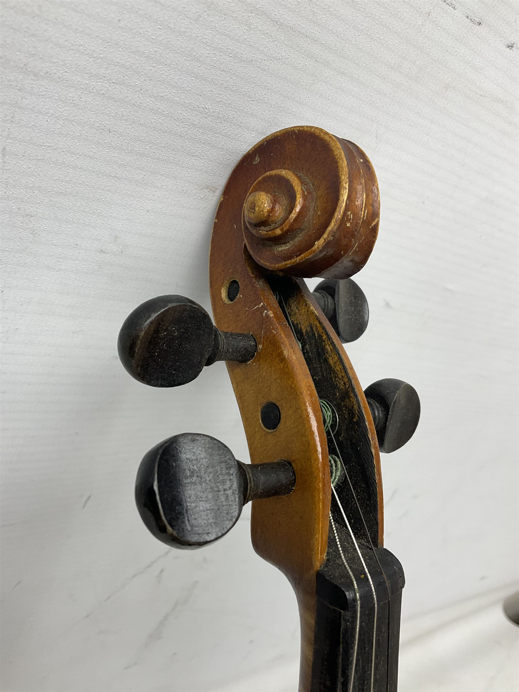Czechoslovakian violin c1920 with 36cm two-piece maple back and ribs and spruce top, bears label 'Copy of Antonius Stradivarius Made in Czechoslovakia' L59cm; in carrying case; 1950s Czechoslovakian violin; and 195os Czechoslovakian three-quarter size violin; both cased (3)