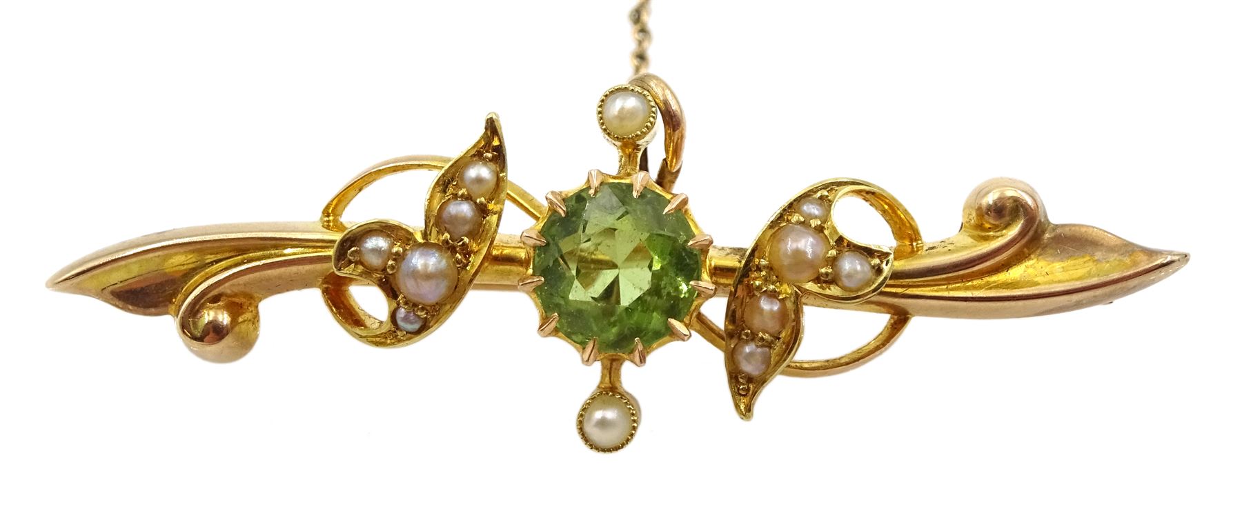 Edwardian gold peridot and split seed pearl bar brooch stamped 15ct, boxed